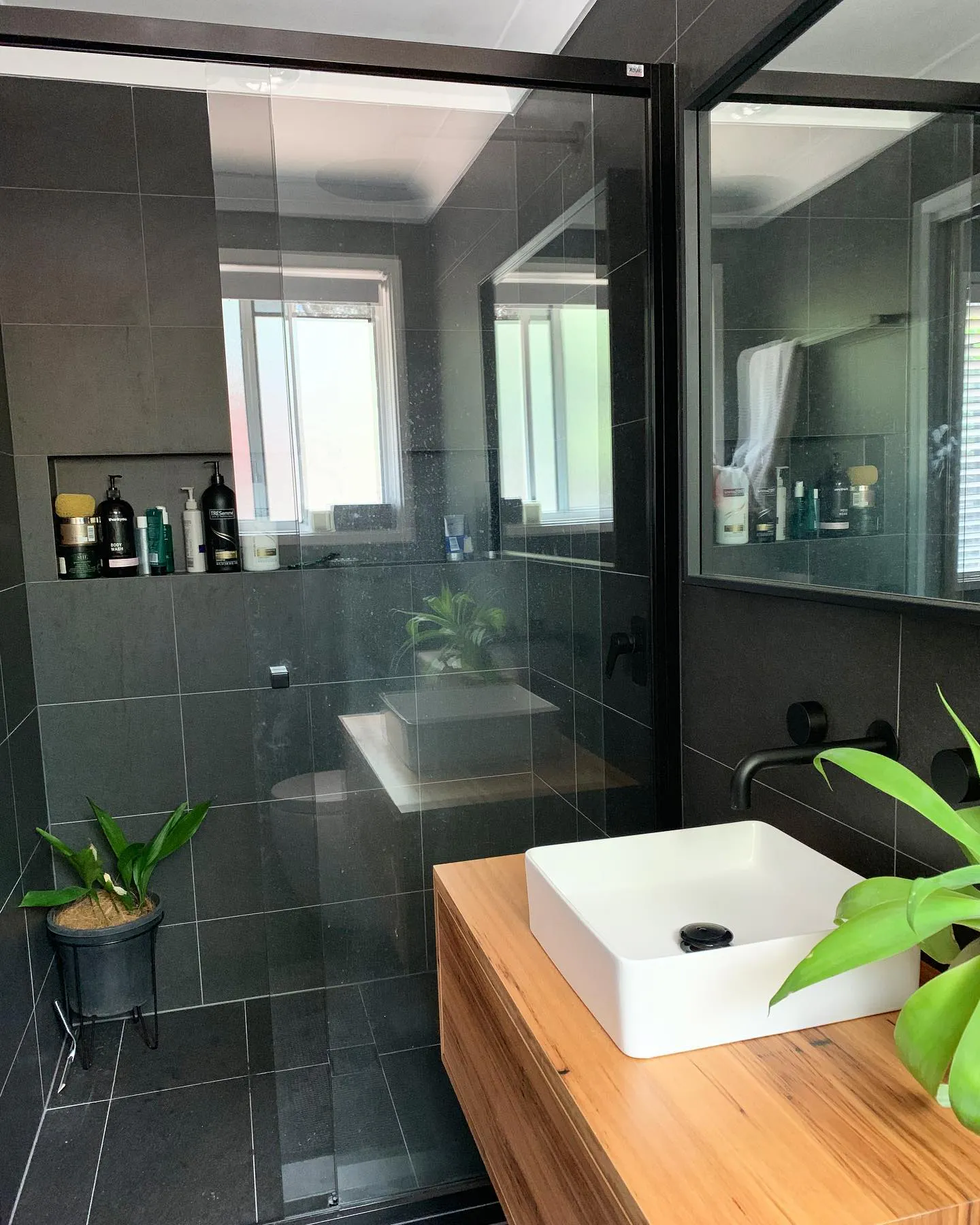 Renovated bathroom in a Red Hill home with premium tiling, a freestanding vanity and layered lighting